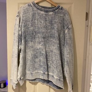 Distressed denim sweater